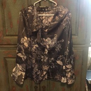 Silver gray, light gold in floral pattern blouse.